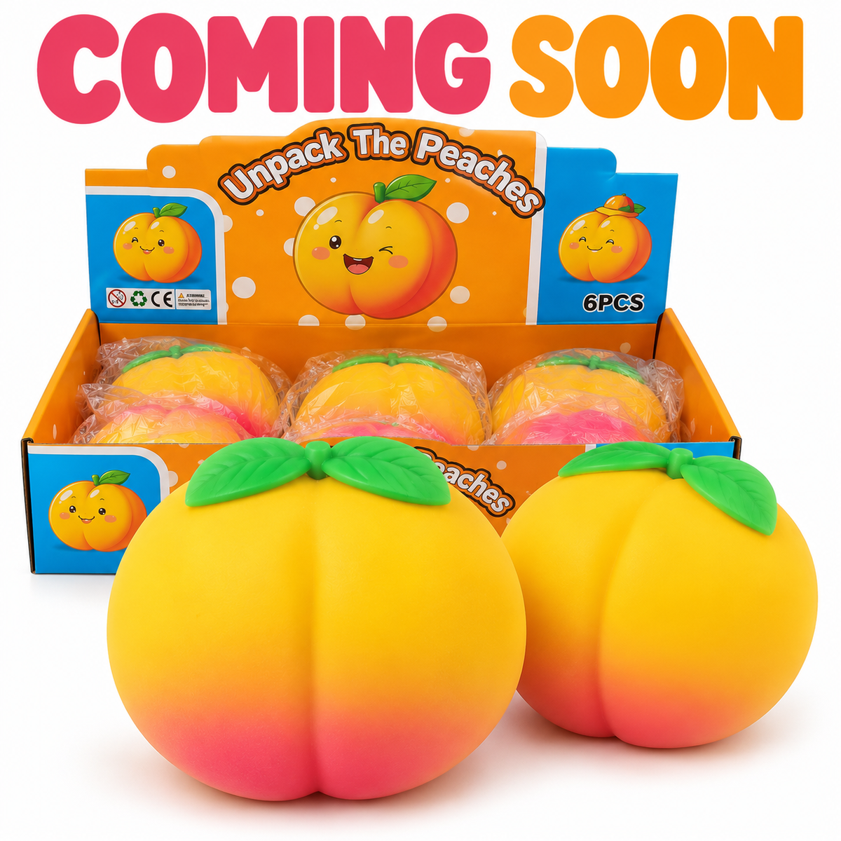 large yellow and pink peach squishy toy with green leaves